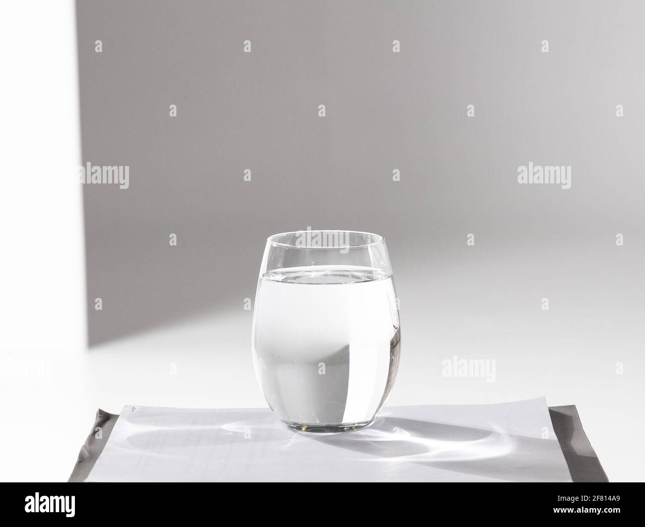 transparent glass full of water with white background Stock Photo