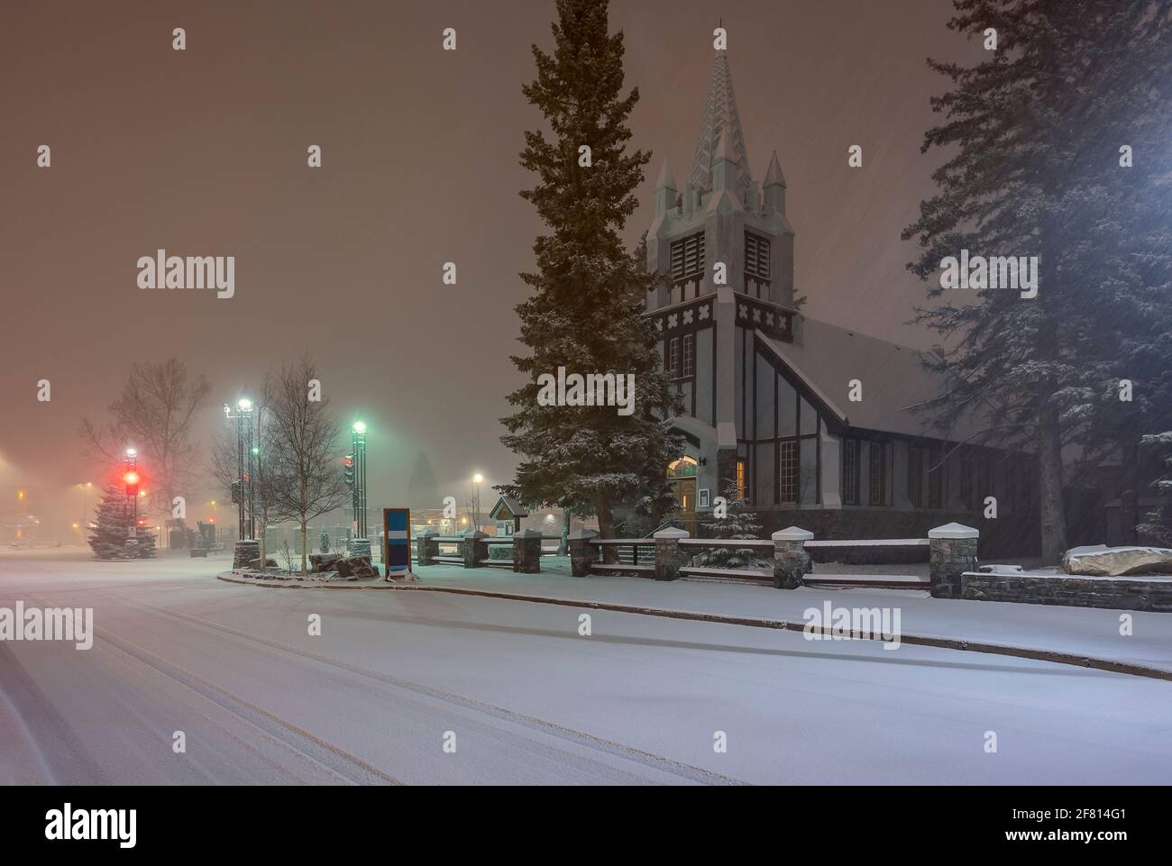 Exterior view of Saint Paul’s Presbyterian Church in Banff during morning snowfall Stock Photo