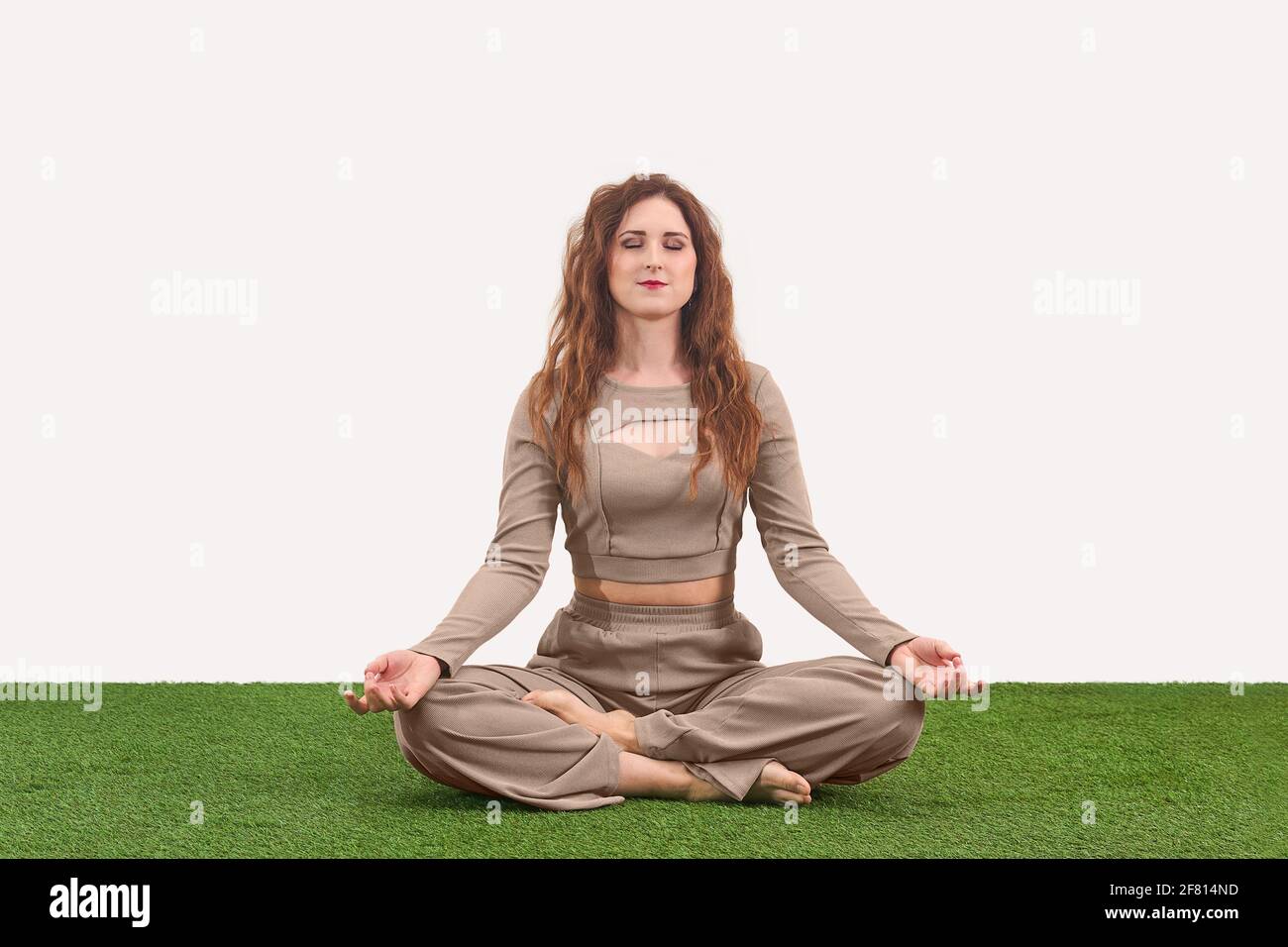 Studio Shot Of Young Woman Meditating In Lotus Position Padmasana High-Res  Stock Photo - Getty Images