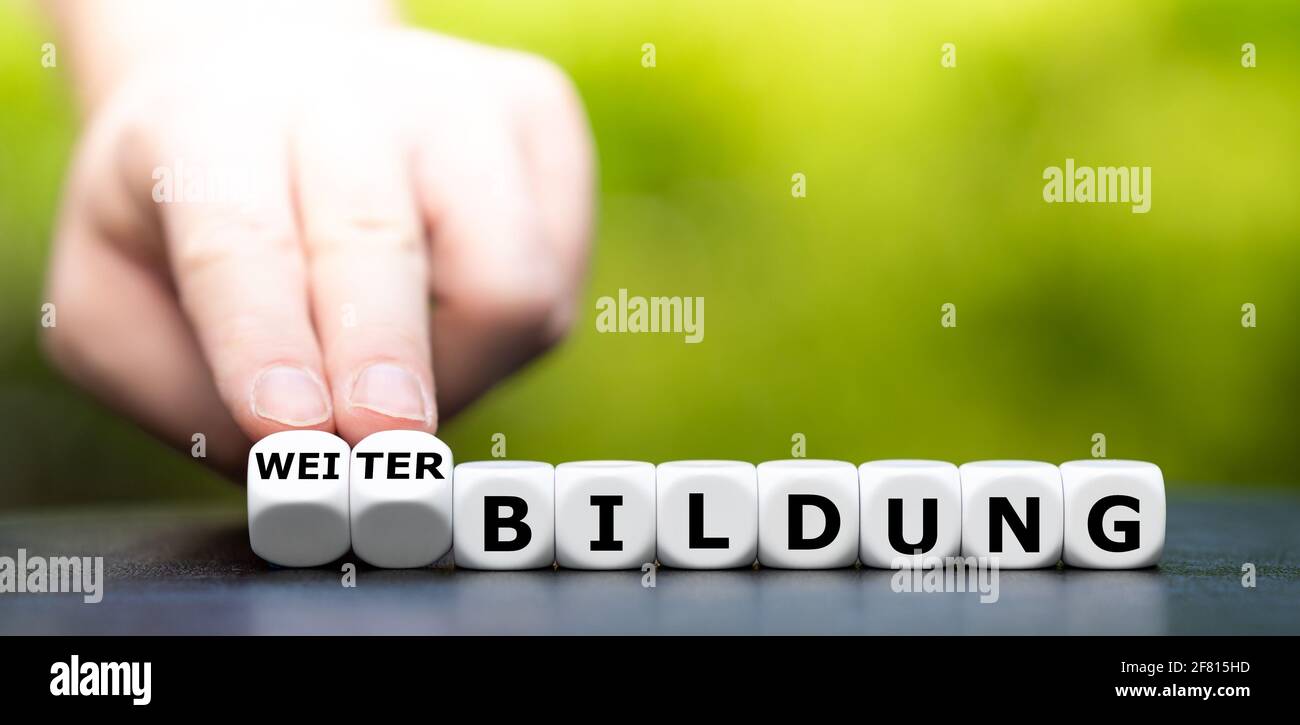 Dice form the German expression 'Weiterbildung' (continuing education). Stock Photo