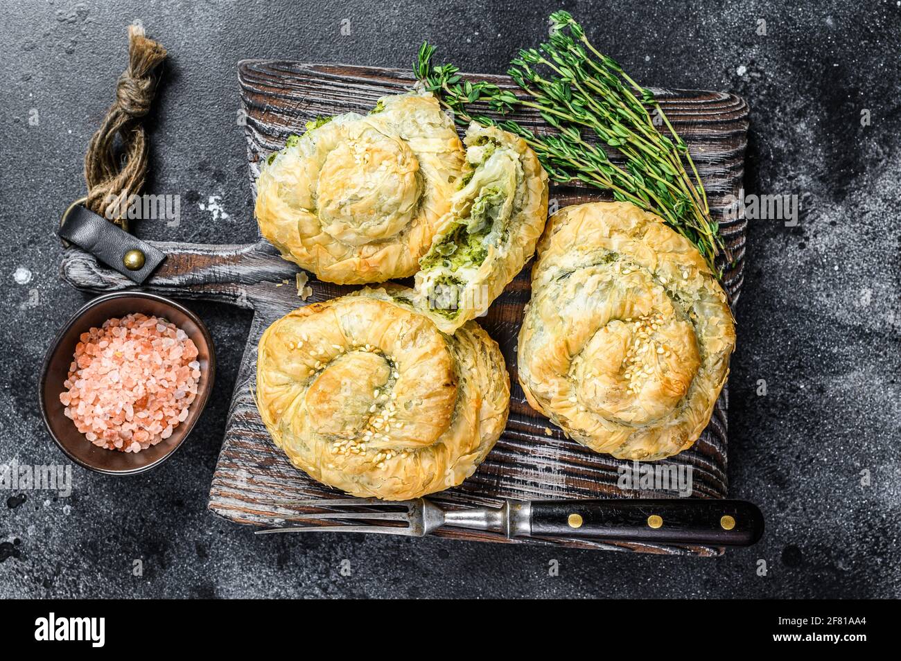 Baked Spanakopita spiral filo pastry puff pie with feta cheese and