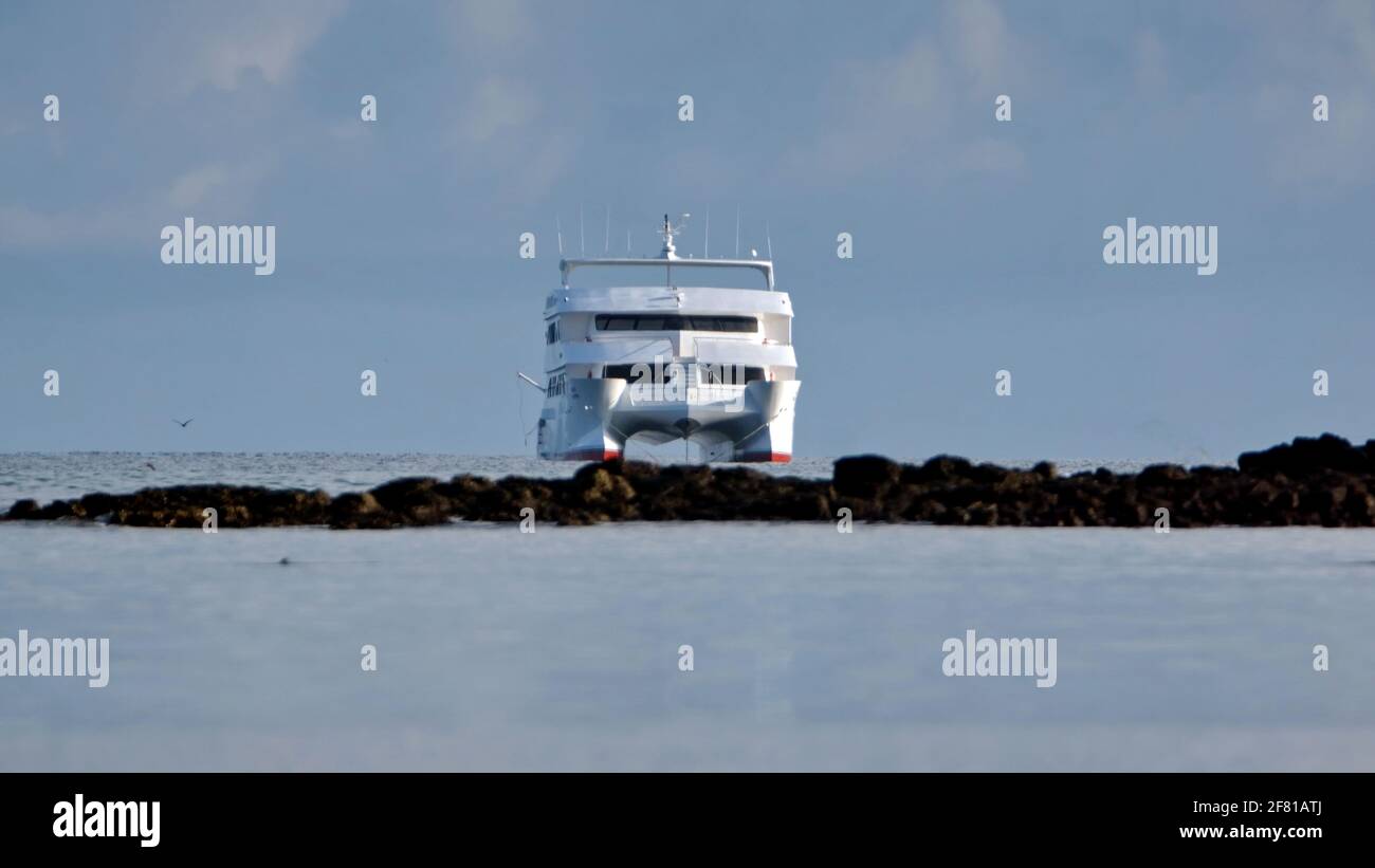Galapagos cruising catamaran moored outside of Caleta Tortuga Negra, Baltra Island, Stock Photo