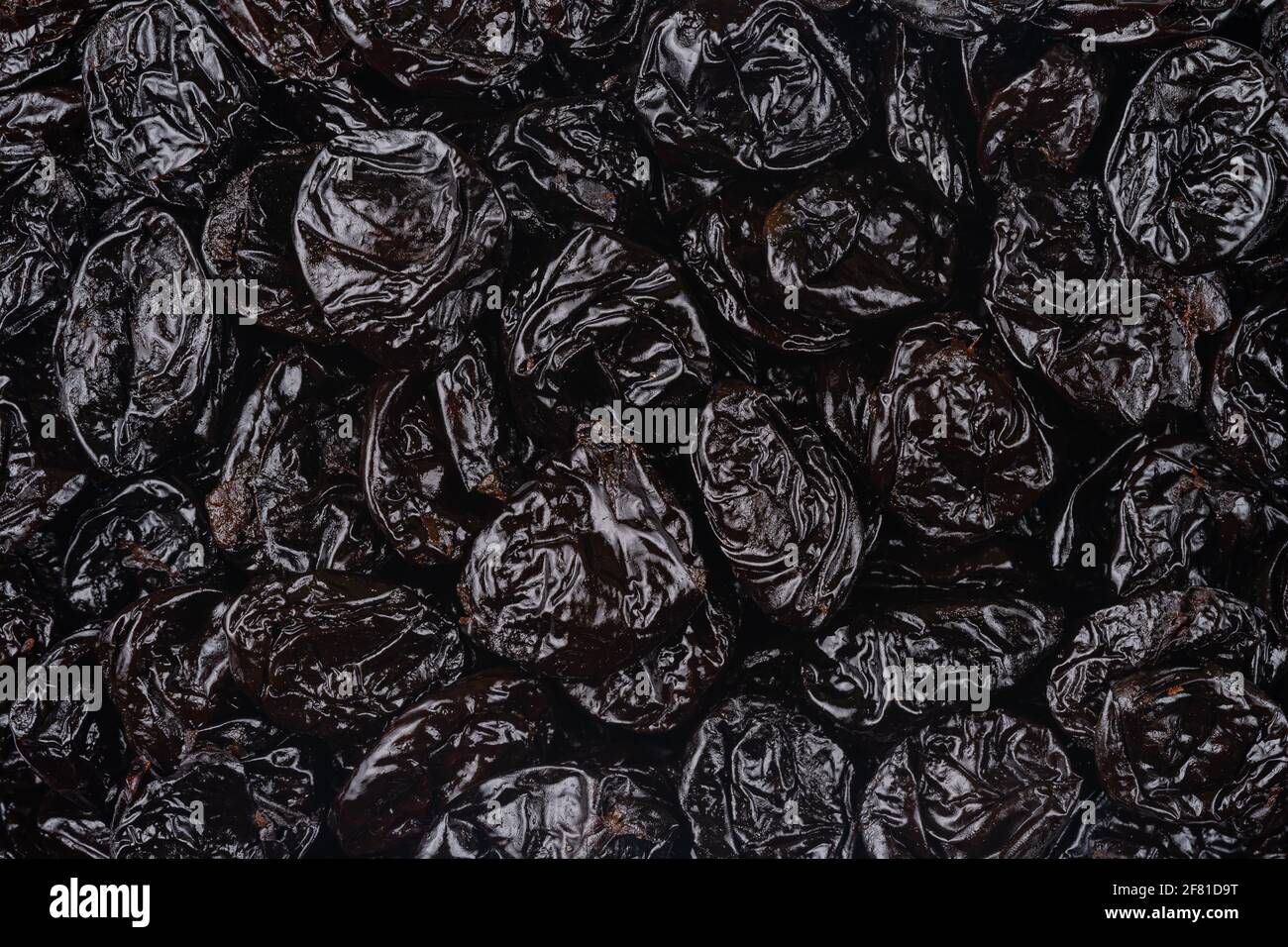 Pattern of dried prunes. Top view, overhead. Stock Photo