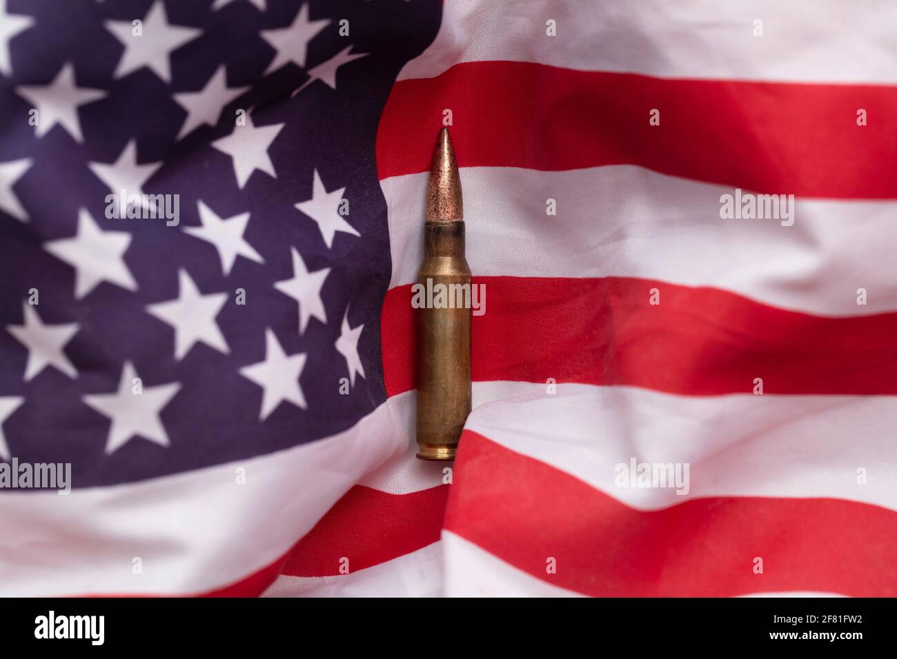 Bullet ammunition on a United states stars and stripes flag Stock Photo