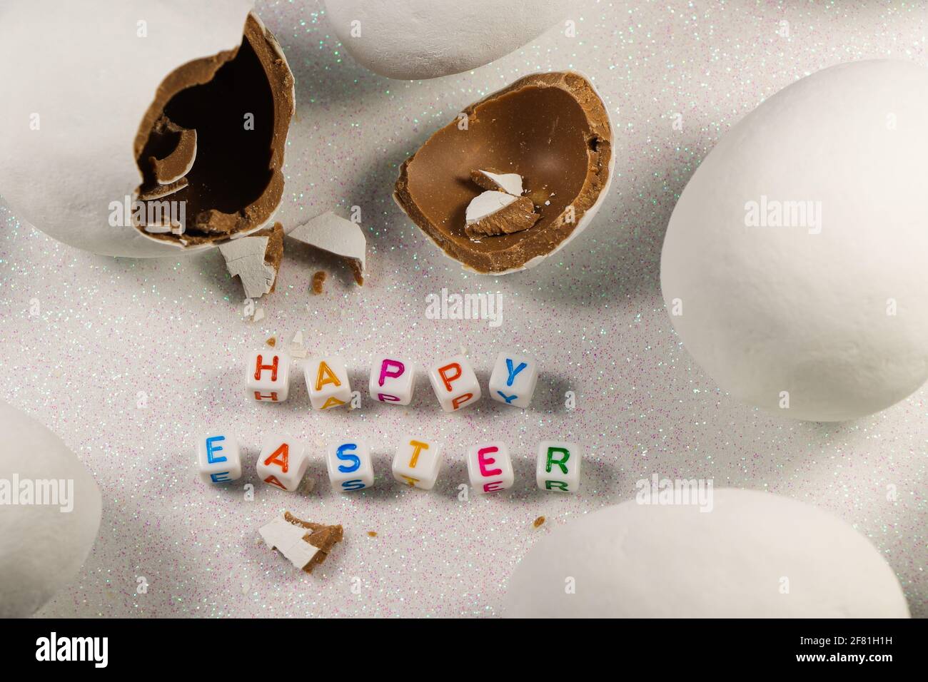 Happy Easter Broken Chocolate Candy Egg With Text Stock Photo
