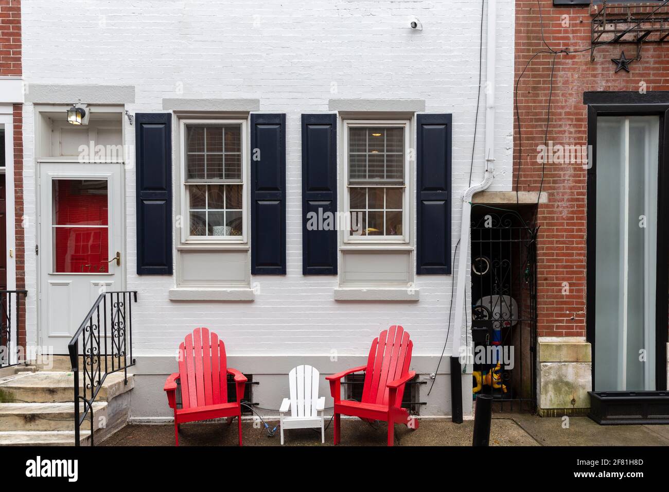 Rows of brownstone apartment buildings in Center City with chairs