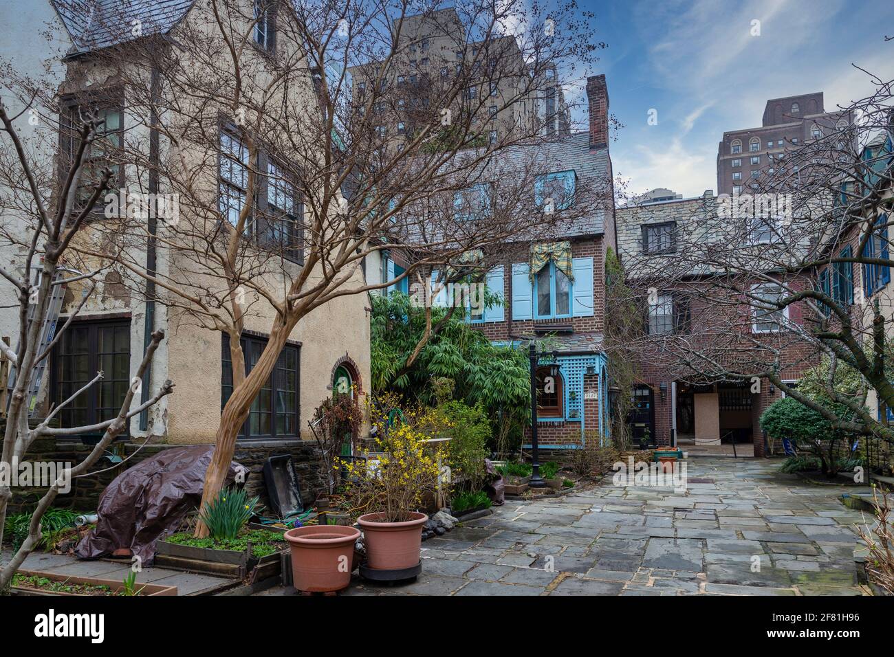 Rows of brownstone apartment buildings in Center City with windows, stoops and planters in