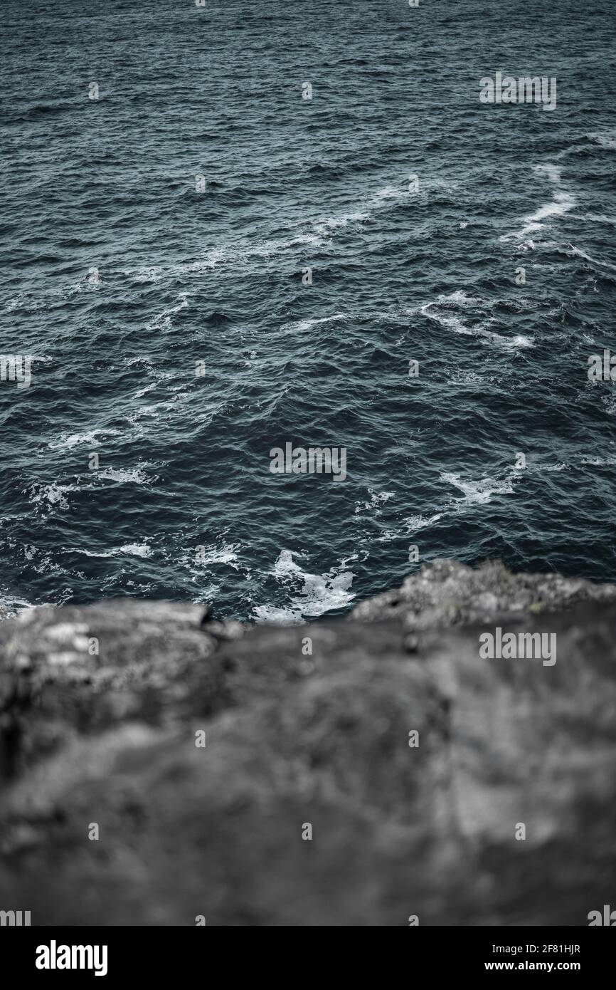 A vertical shot of a beautiful rocky seashore Stock Photo - Alamy