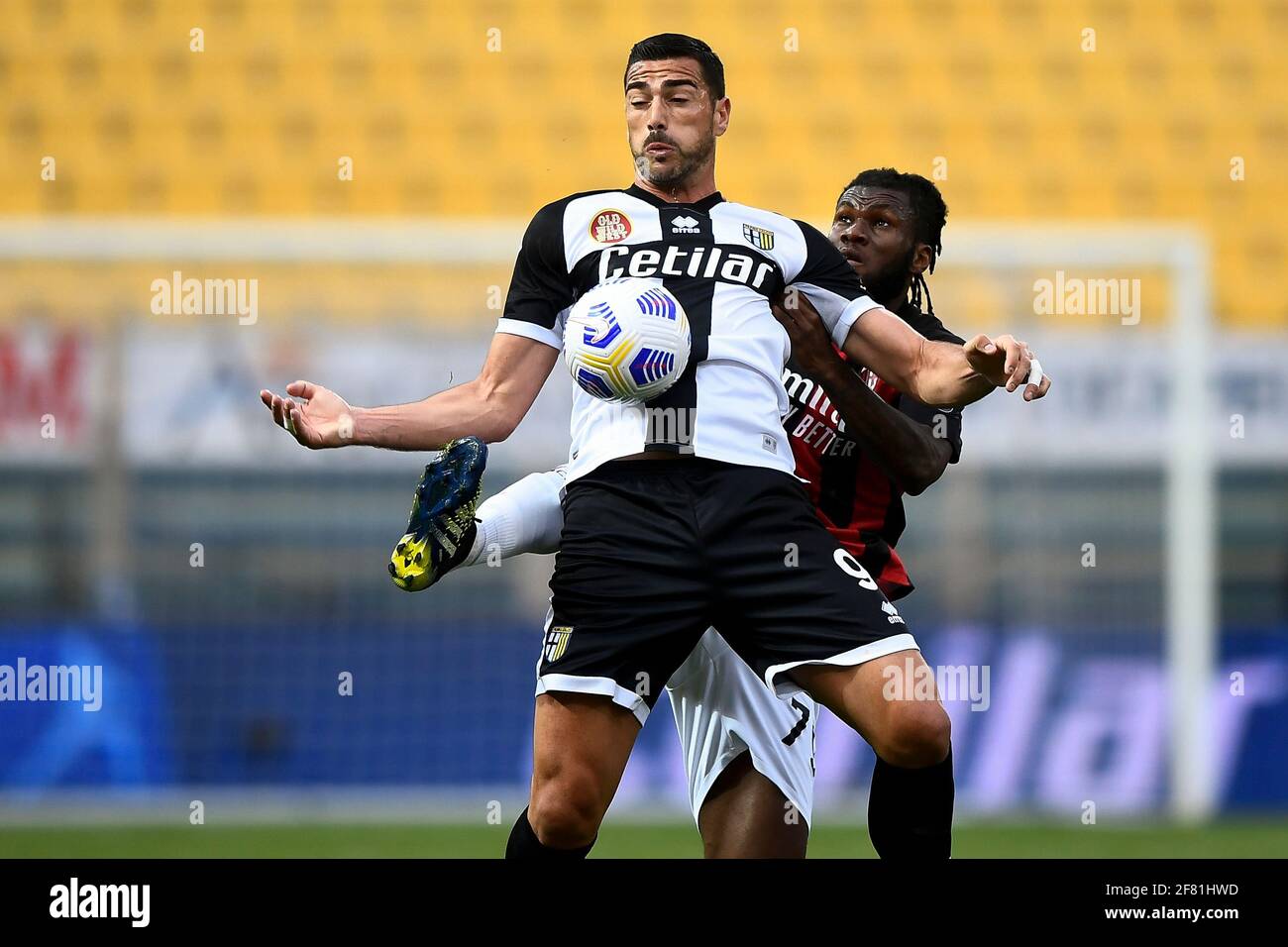 Parma, Italy - 10 April, 2021: Graziano Pelle of Parma Calcio is challenged  by Franck Kessie of AC Milan during the Serie A football match between  Parma Calcio and AC Milan. AC