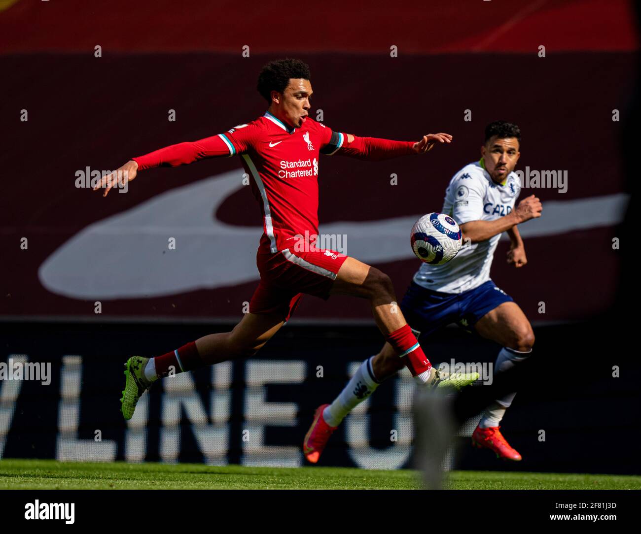 Liverpool. 11th Apr, 2021. Liverpool's Trent Alexander-Arnold (L) competes during the Premier League match between Liverpool FC and Aston Villa FC at Anfield in Liverpool, Britain, on April 10, 2021. Credit: Xinhua/Alamy Live News Stock Photo
