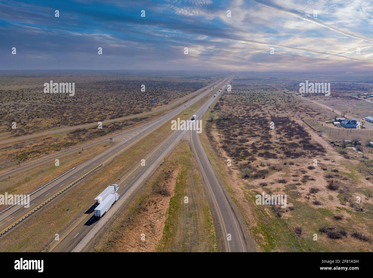 Desert road aerial of a new two lane road surrounded by desert