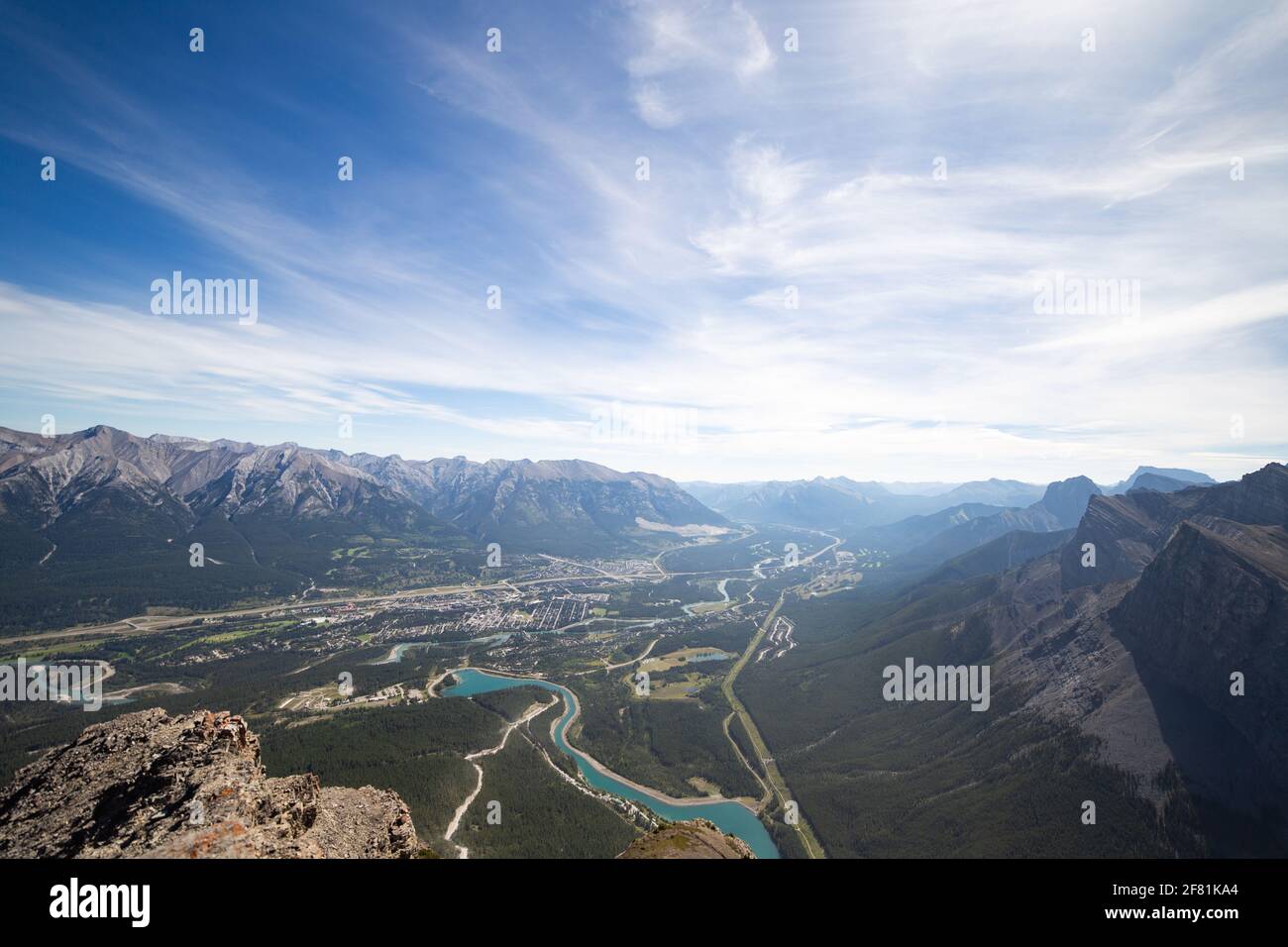 aerial view of a small mountain town in summer with clouds in the sky ...