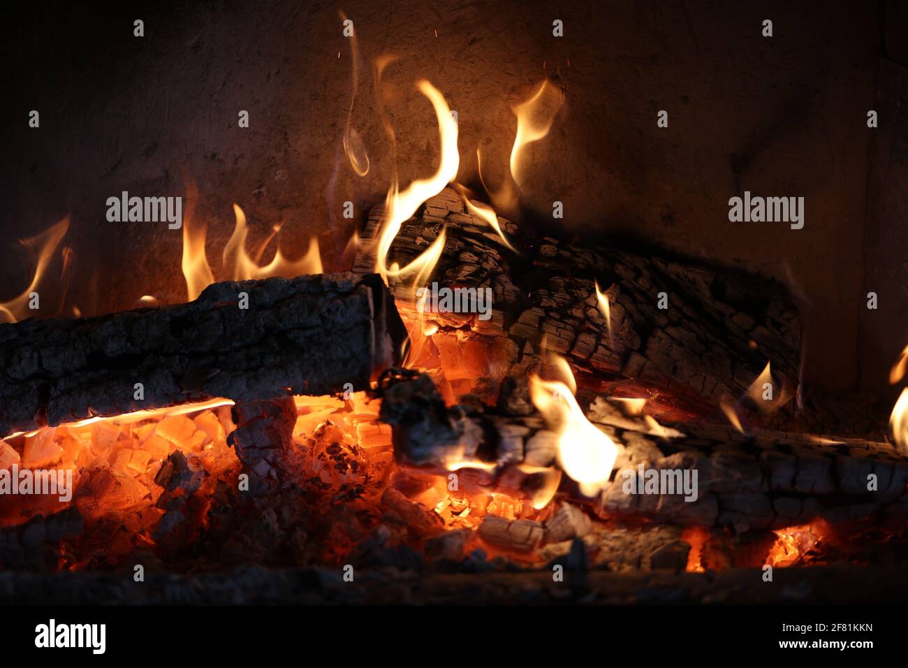 A nice fireplace with burning firewood Stock Photo