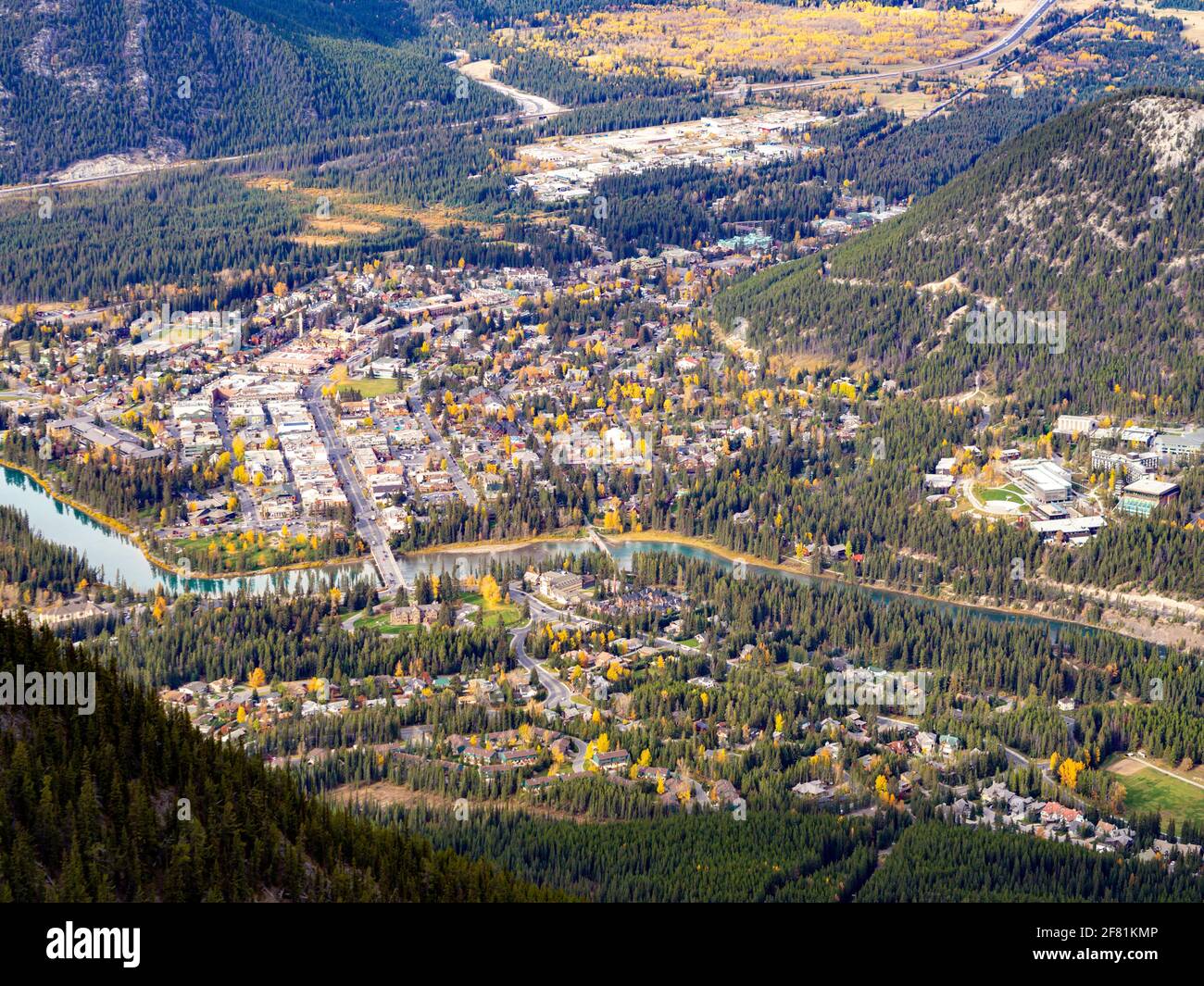 view of a town surrounded by forest with a river Stock Photo - Alamy
