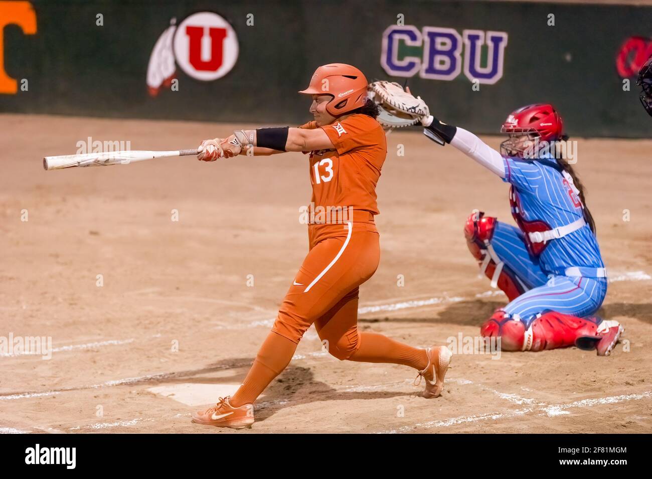 A Texas Longhorn Player Is Batting Against The Ole Miss Rebels At The