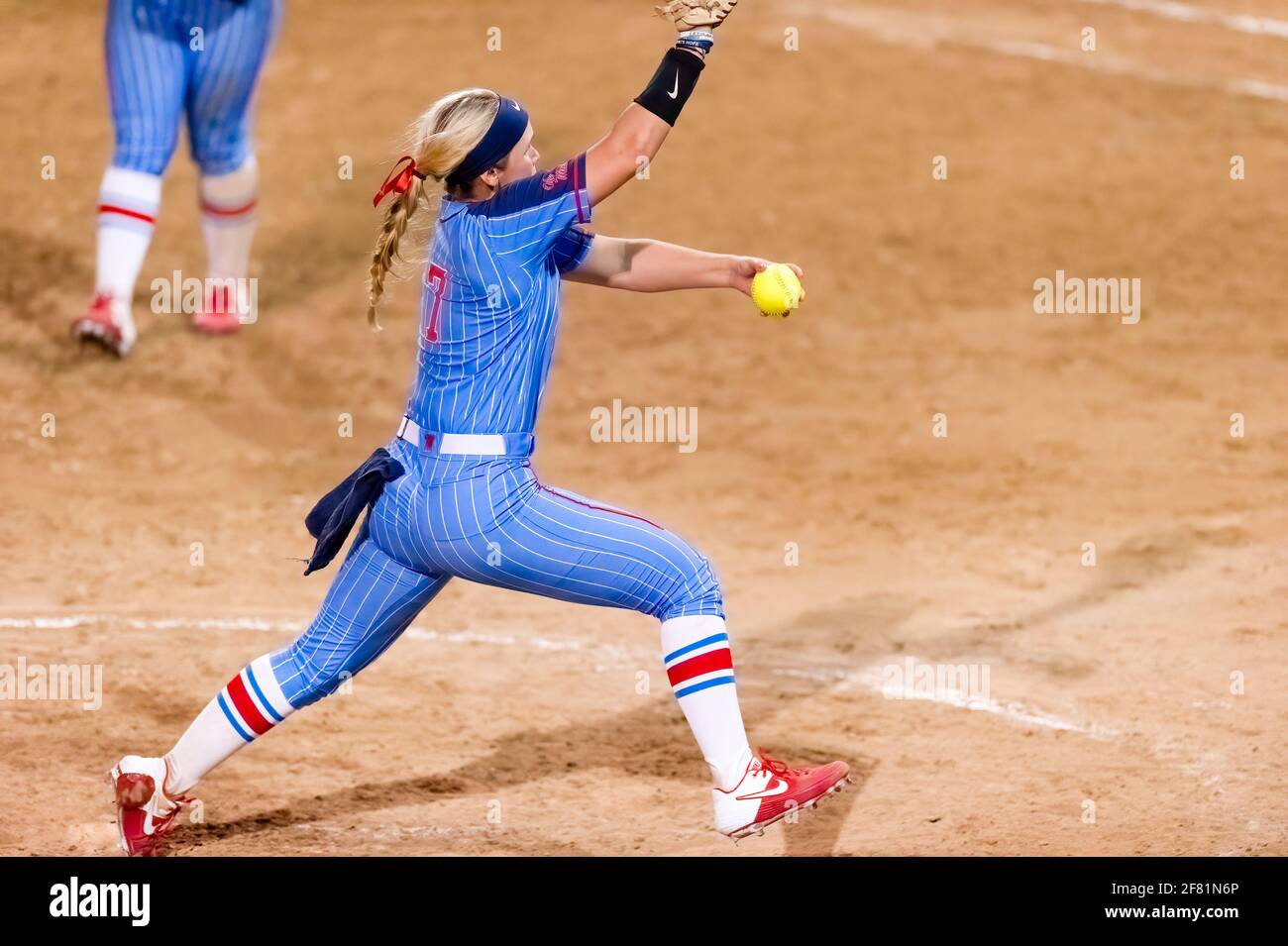 The Ole Miss Rebel Pitcher Is Winding Up To Make a Pitch To Home Plate Stock Photo