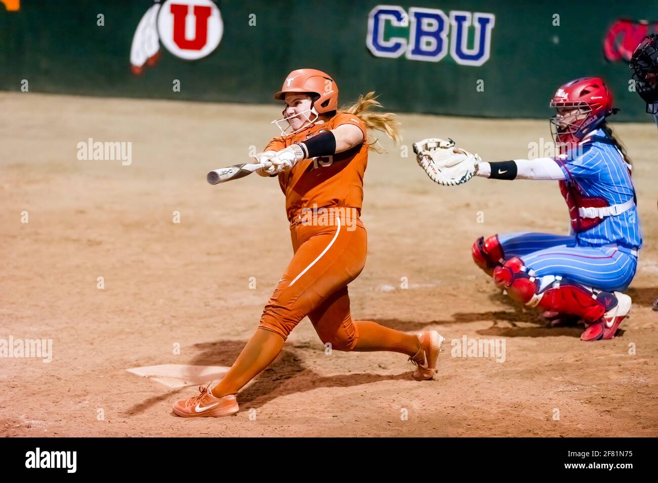 A Texas Longhorn Player Is Batting Against The Ole Miss Rebels At The