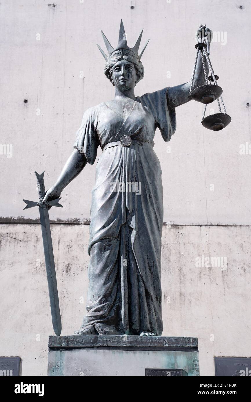Statue of Lady Justice with the sword in one hand and the scales of