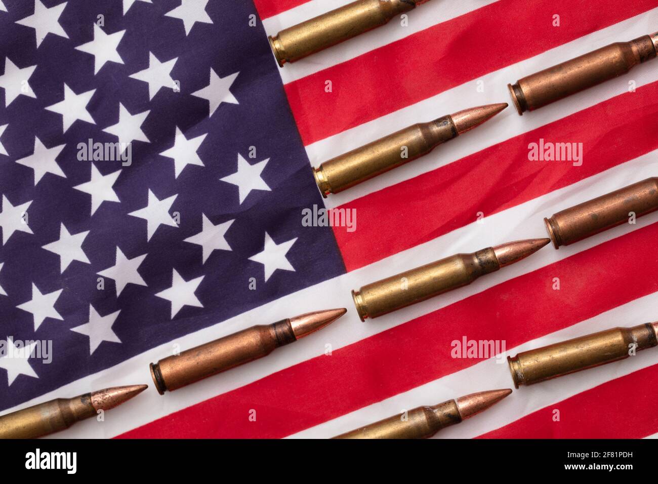 Bullet ammunition on a United states stars and stripes flag Stock Photo