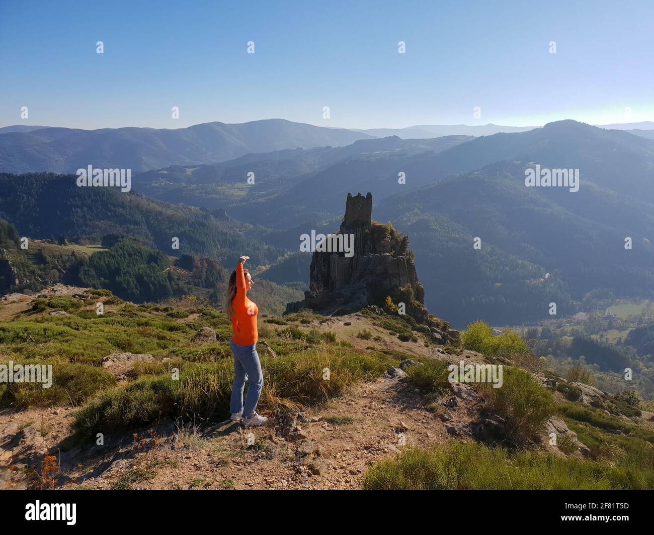 girl standing on a hill in summer Stock Photo