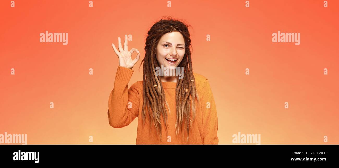 Cheerful young woman showing ok hi-res stock photography and images - Alamy