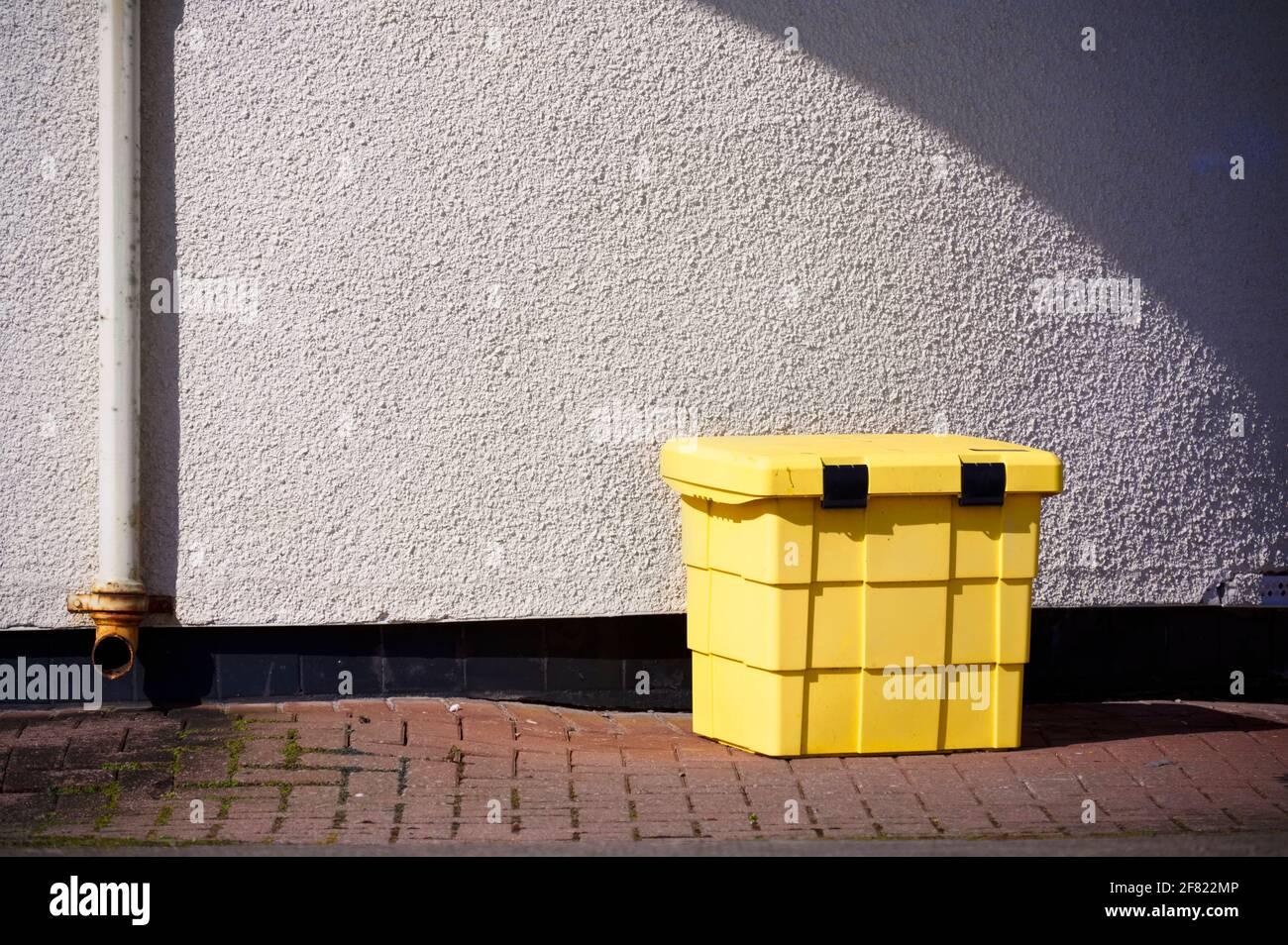 Large yellow bin for rubbish with secure lock Stock Photo Alamy