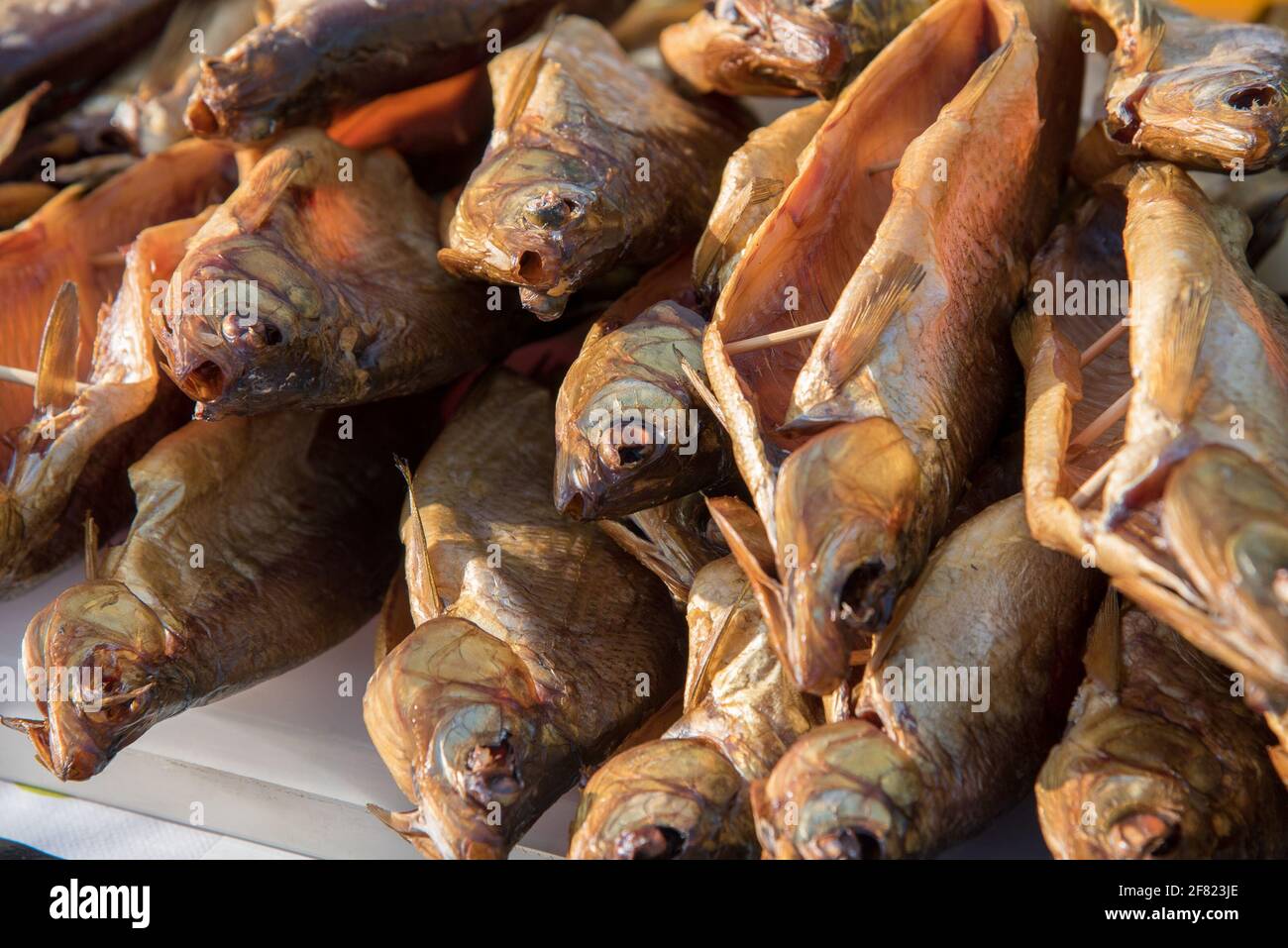 Smoked and dried cured fish are sold on the market counter on the street Stock Photo Alamy