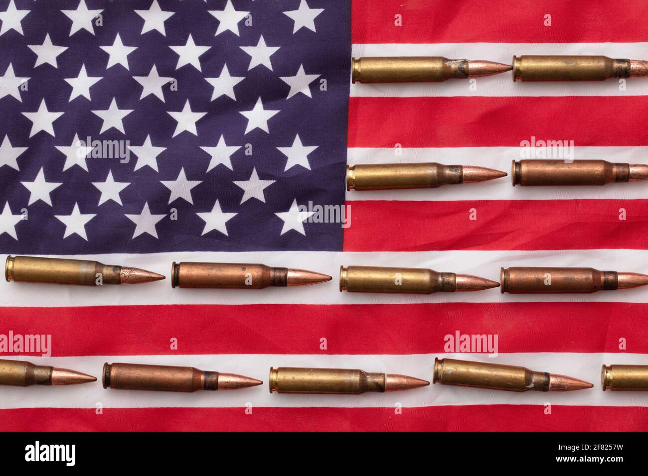 Bullet ammunition on a United states stars and stripes flag Stock Photo