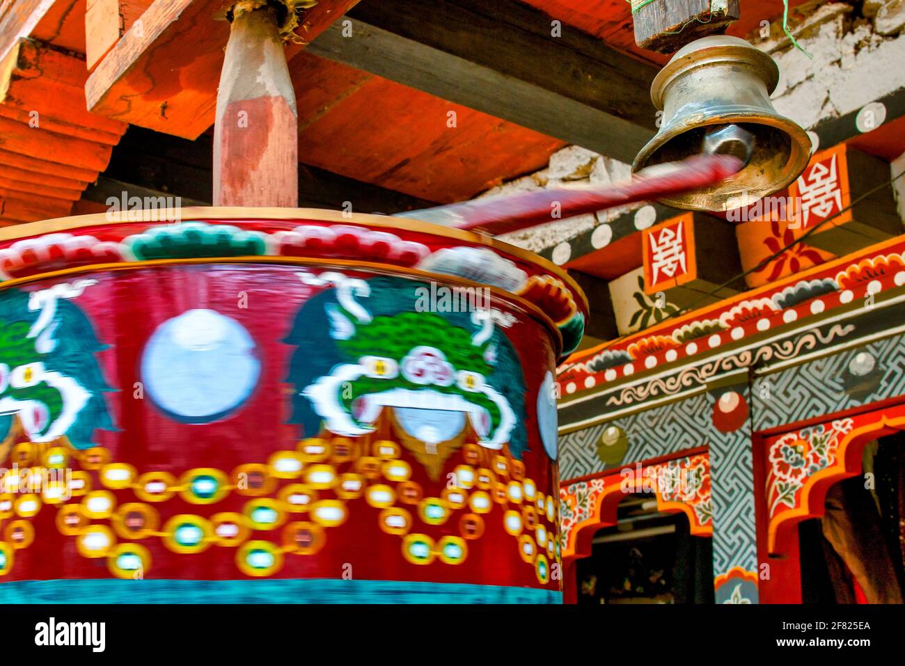 Bhutanese prayer wheel with bell, Mongar District, Bhutan Stock Photo