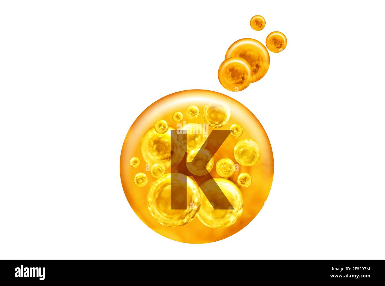 Vitamin K capsule. Golden balls with bubbles isolated on white