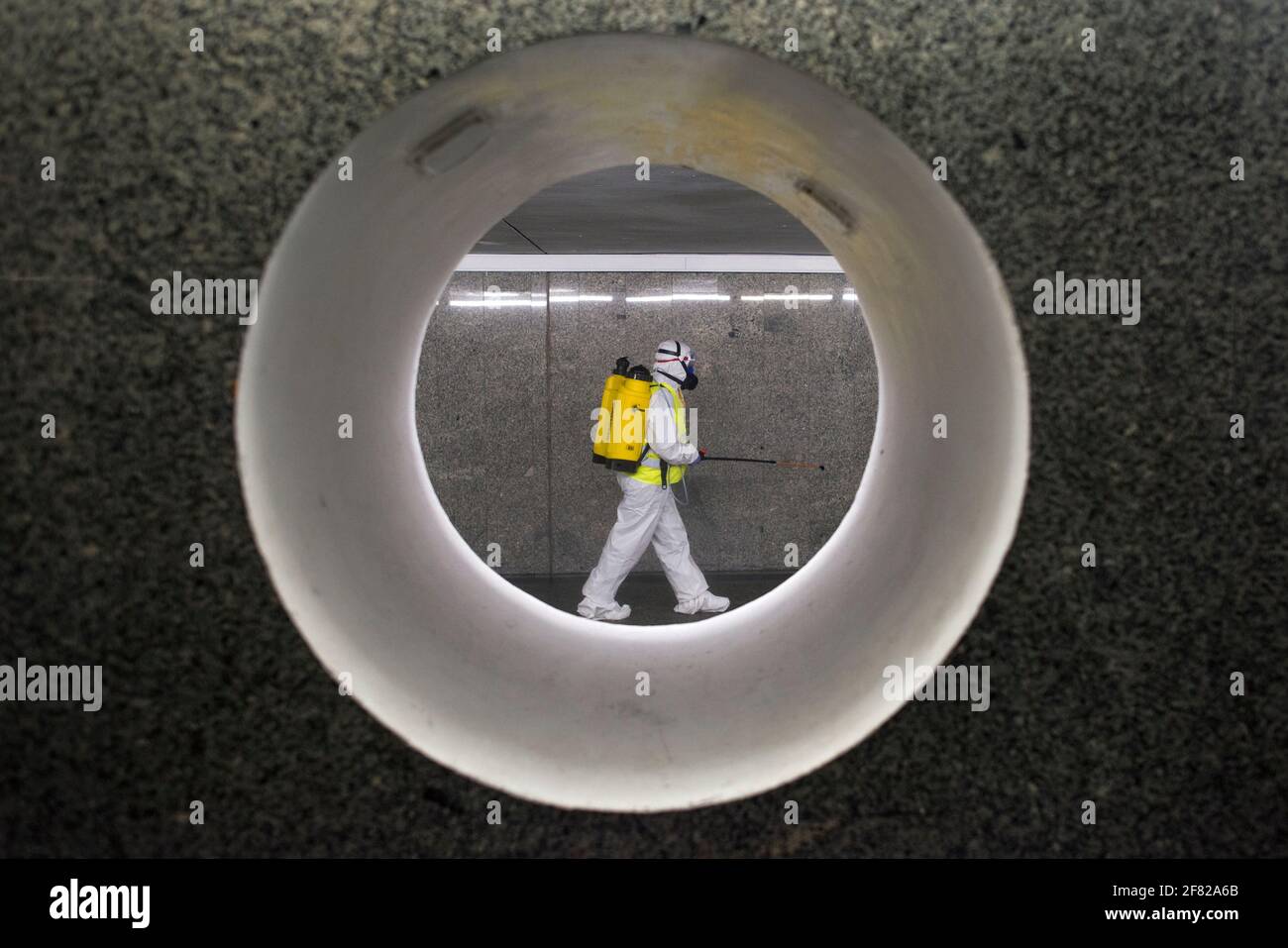 Cleaning service workers are seen disinfecting one of the most