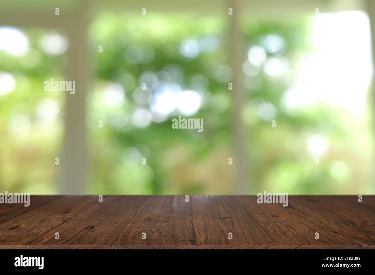 Empty wooden table in front of abstract blurred Cafe, restaurant at ...
