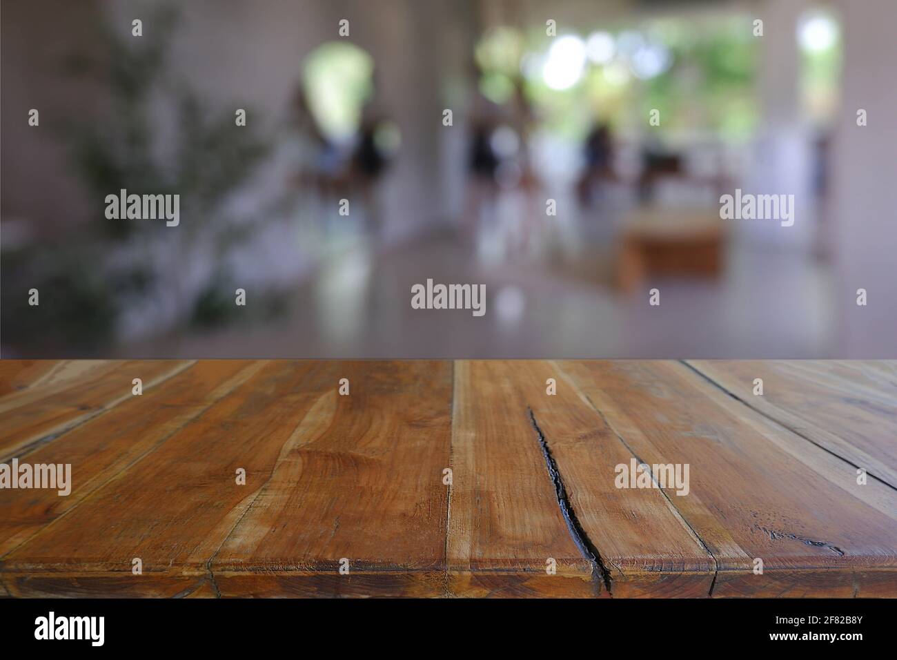 Empty wooden table in front of abstract blurred Cafe, restaurant at ...