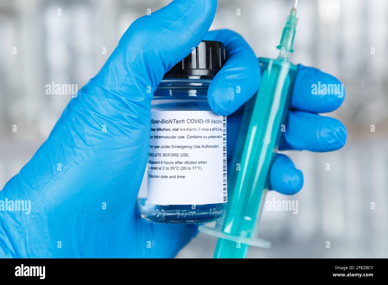 Stuttgart, Germany - March 19, 2021: Biontech Pfizer Coronavirus Vaccine Corona Virus COVID-19 Covid syringe vaccines in Germany. Stock Photo