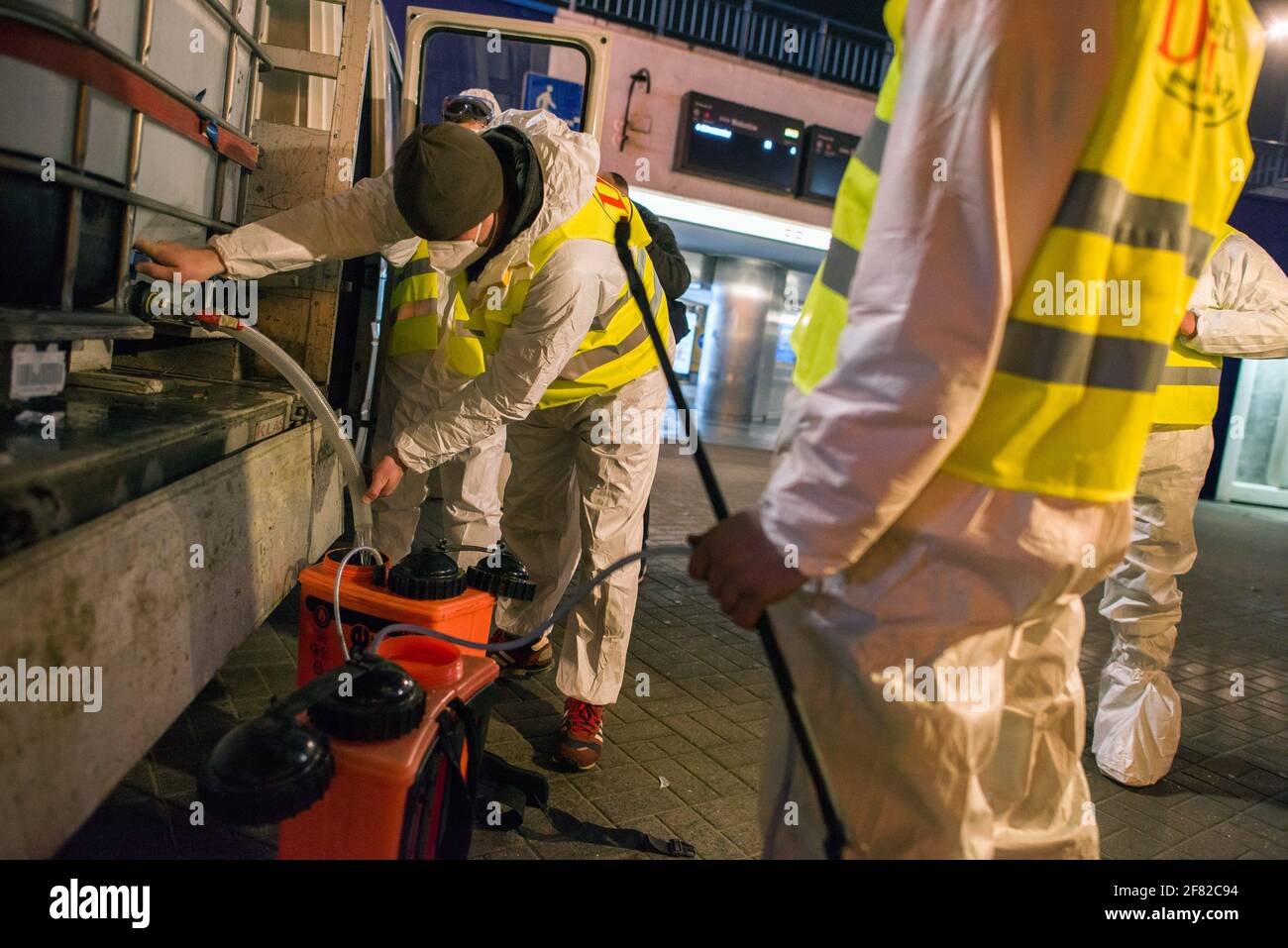 Cleaning service workers are seen filling up their tanks with