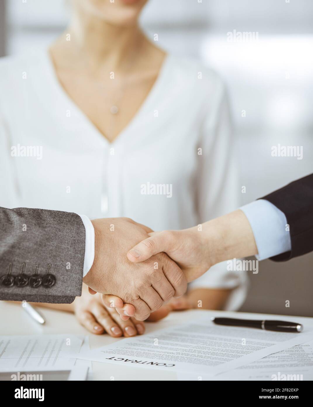 Business people shaking hands finishing contract signing, close-up. Business communication concept. Handshake and marketing Stock Photo