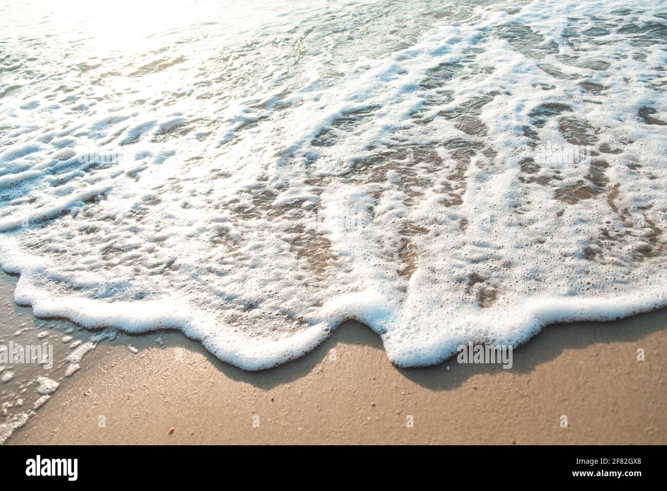 Close Up Wave Sand Beach Sea Foam. Closeup of sea wave with foam on ...