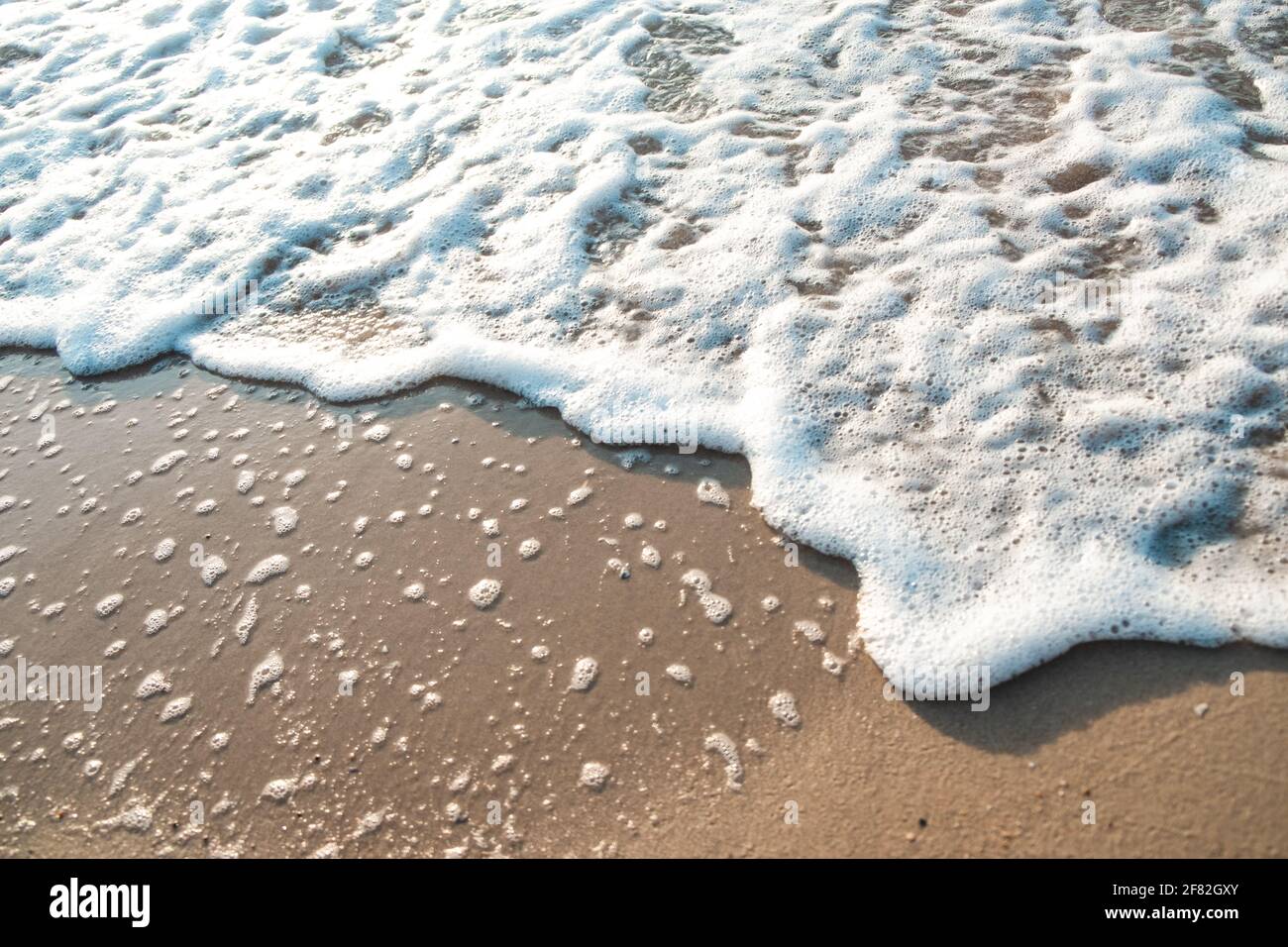 Close Up Wave Sand Beach Sea Foam. Closeup of sea wave with foam on ...