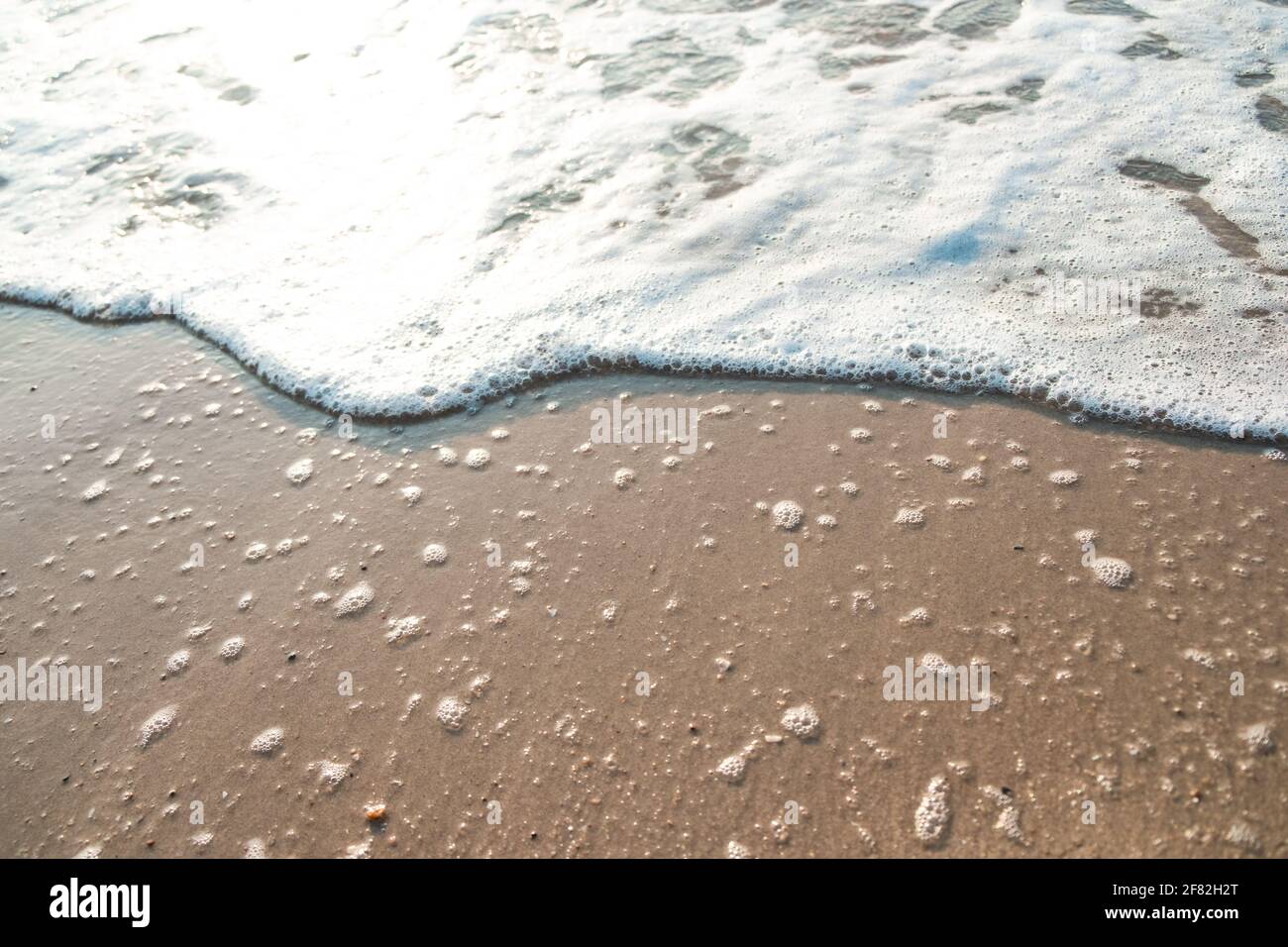 Close Up Wave Sand Beach Sea Foam. Closeup of sea wave with foam on ...