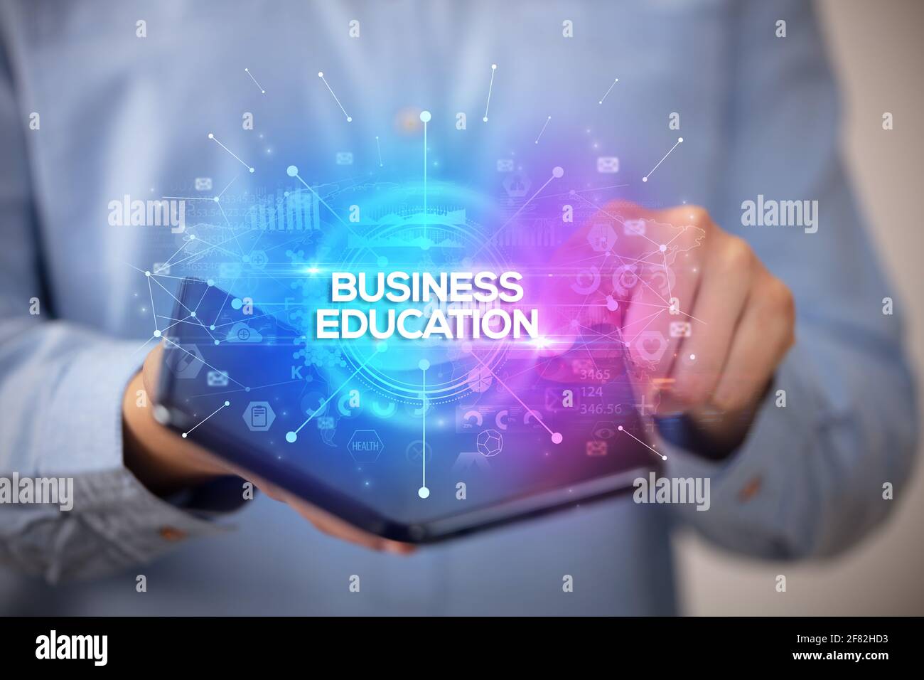 Businessman holding a foldable smartphone, new business concept Stock Photo