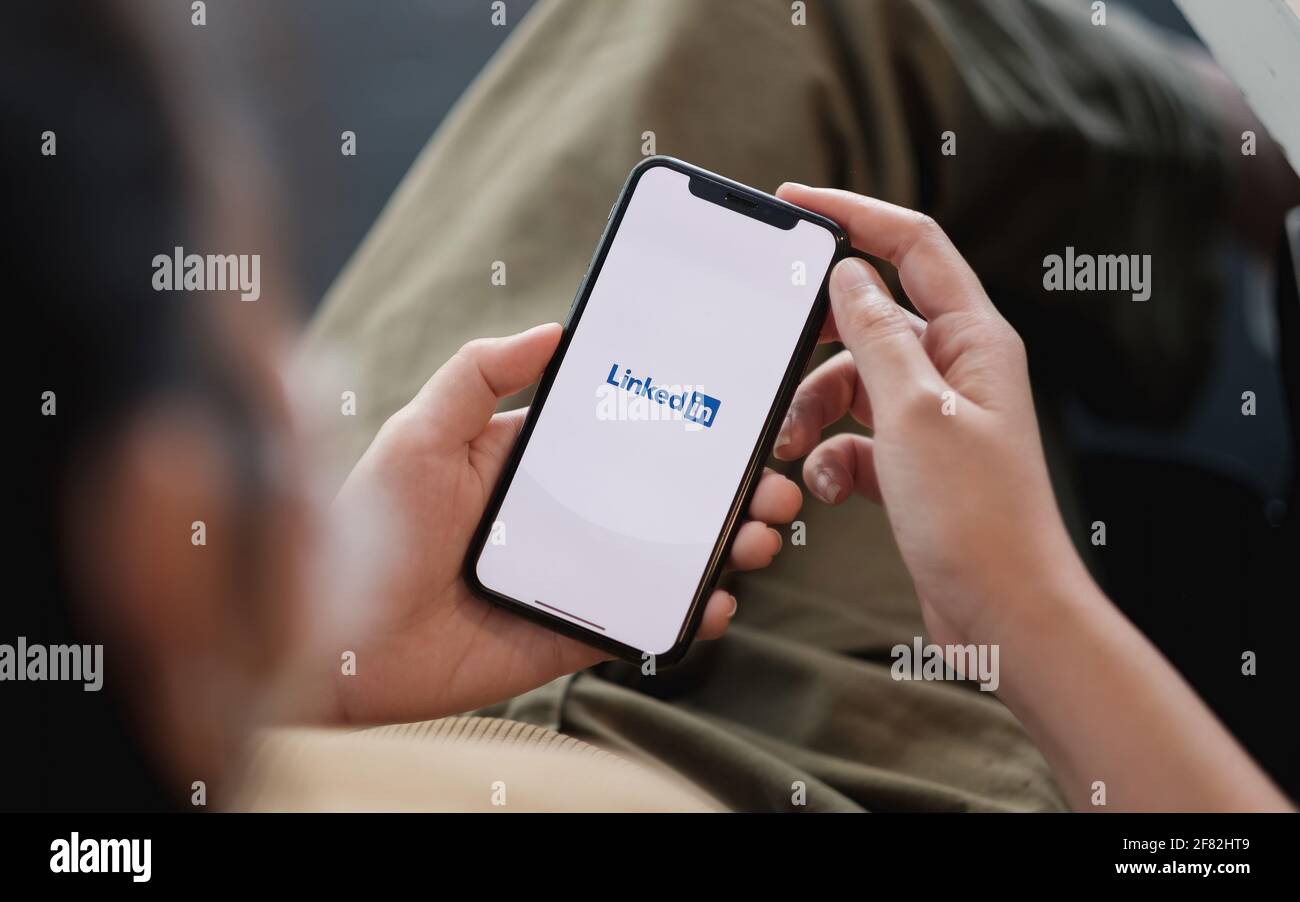 CHIANG MAI, THAILAND - APR 11, 2021: iPhone xs with LinkedIn application on the screen. LinkedIn is a business-oriented social networking service Stock Photo