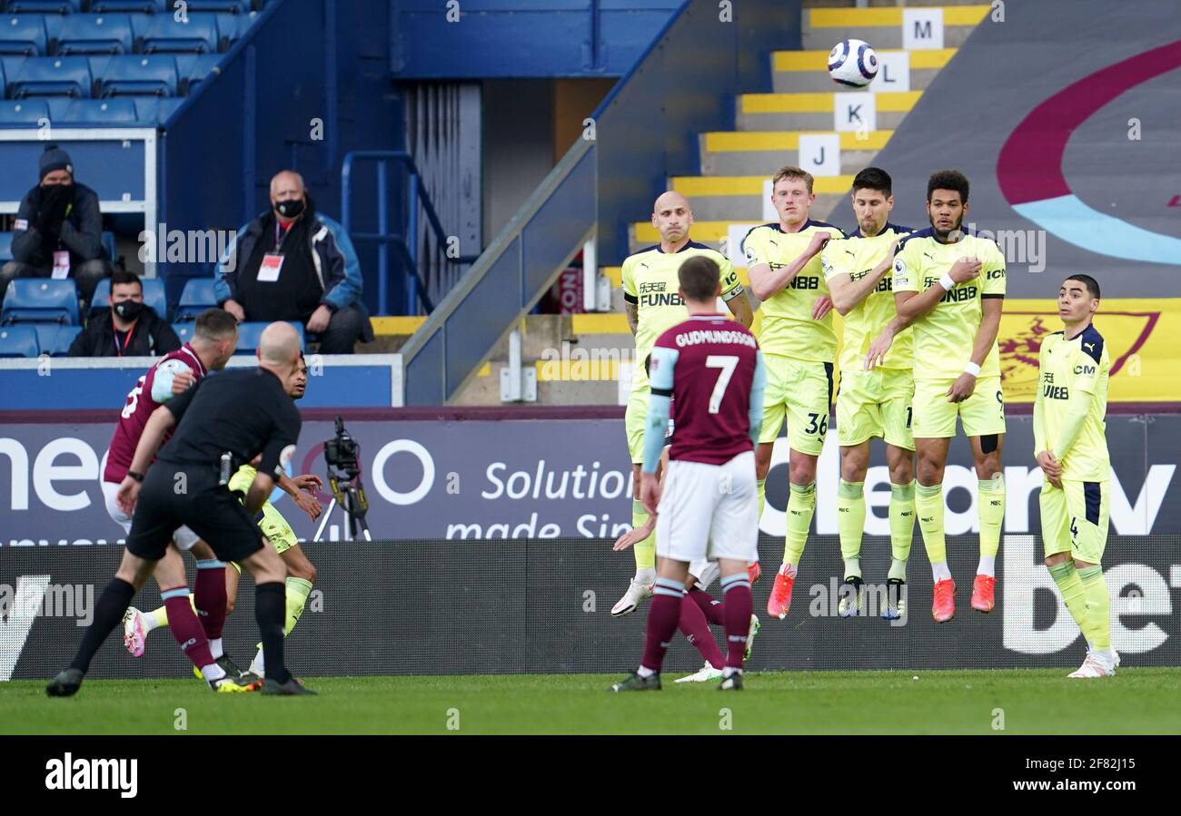 Newcastle United players form a wall against a free kick from Burnley's Josh Brownhill (left) during the Premier League match at Turf Moor, Burnley. Picture date: Sunday April 11, 2021. Stock Photo