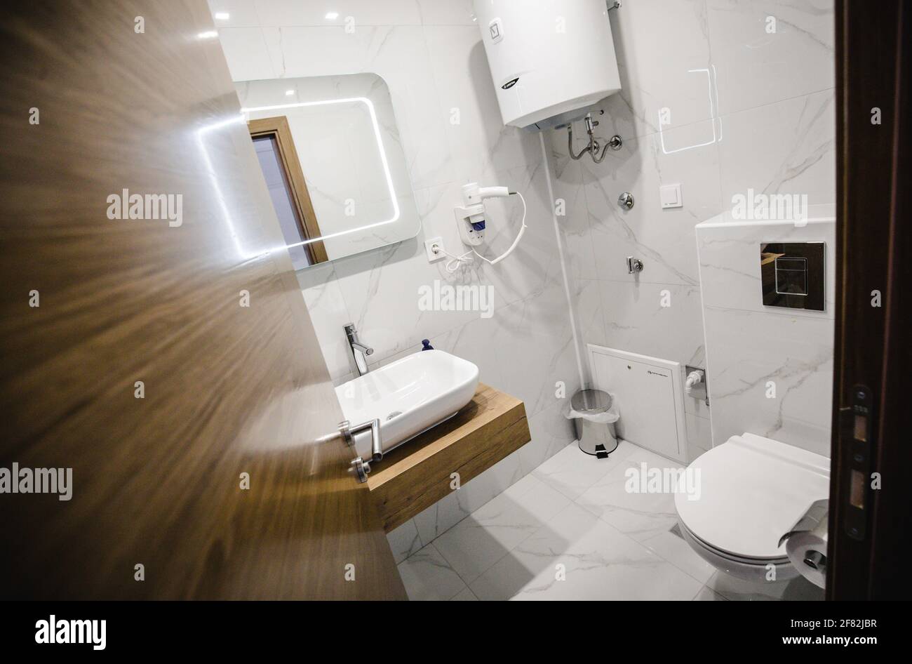 Open Restroom An open door to a bathroom Stock Photo - Alamy