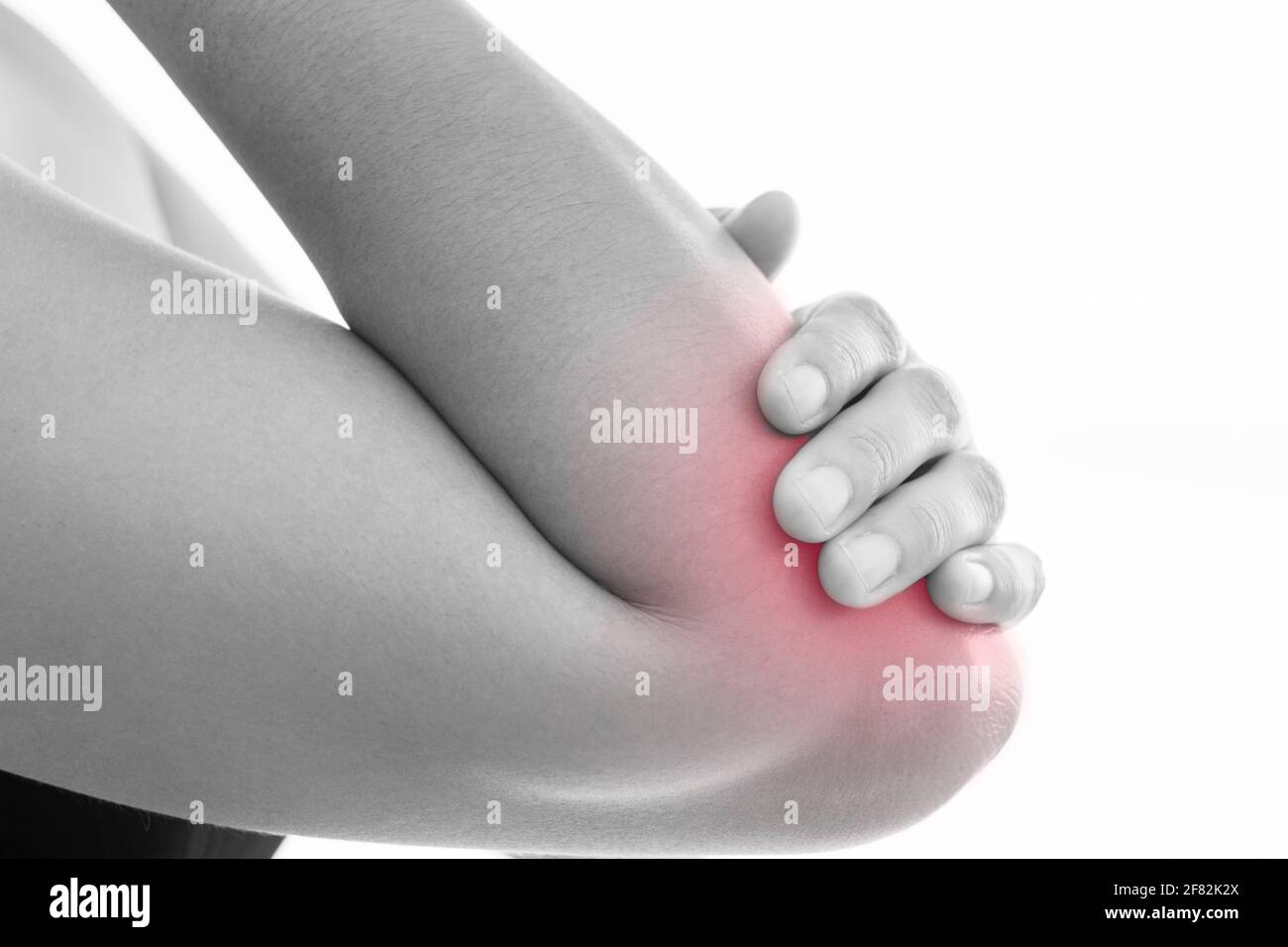 Lateral view of a young women elbow muscle pain. Red around the pain area Stock Photo