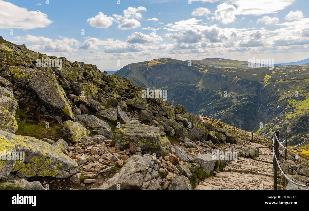Long mountain trail with panorama of Karkonosze Giant Mountains around Stock Photo