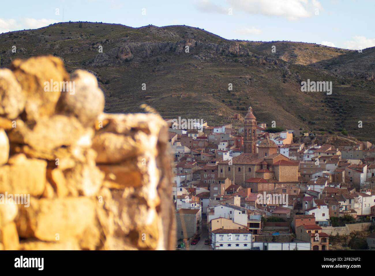 A beautiful Mediterranean mountain town landscape behind blurry ...