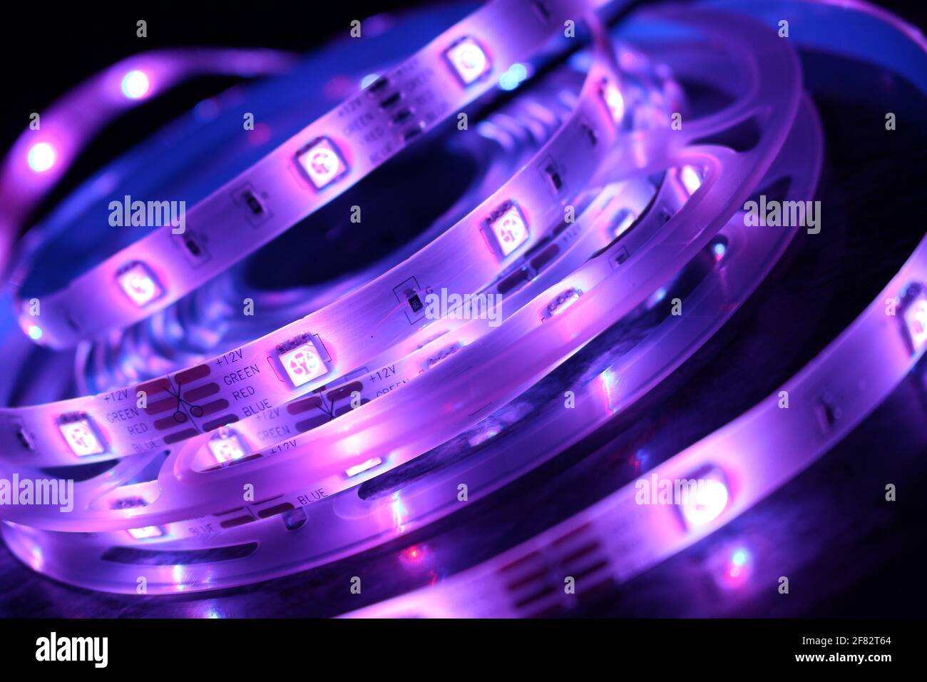 Purple Colour Led A closeup shot of a roll of illuminated purple led lights Stock Photo ...