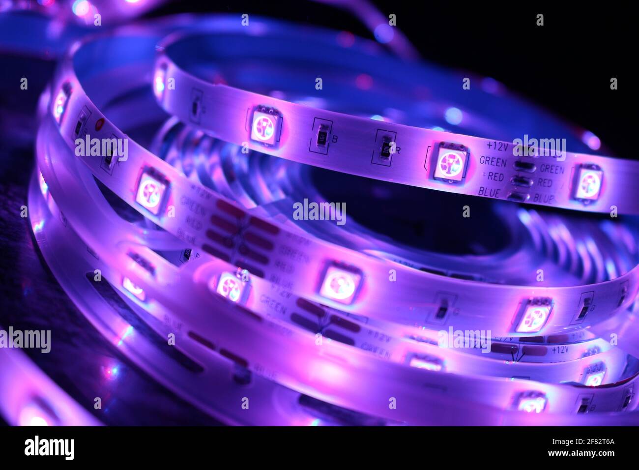 Purple Colour Led A closeup shot of a roll of illuminated purple led lights Stock Photo ...