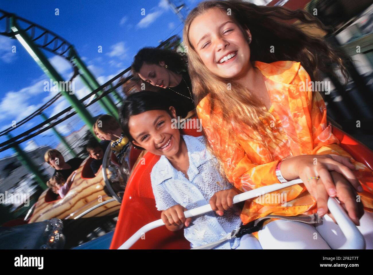 Young girls on a mini roller coaster ride, Adventure Island. Southend