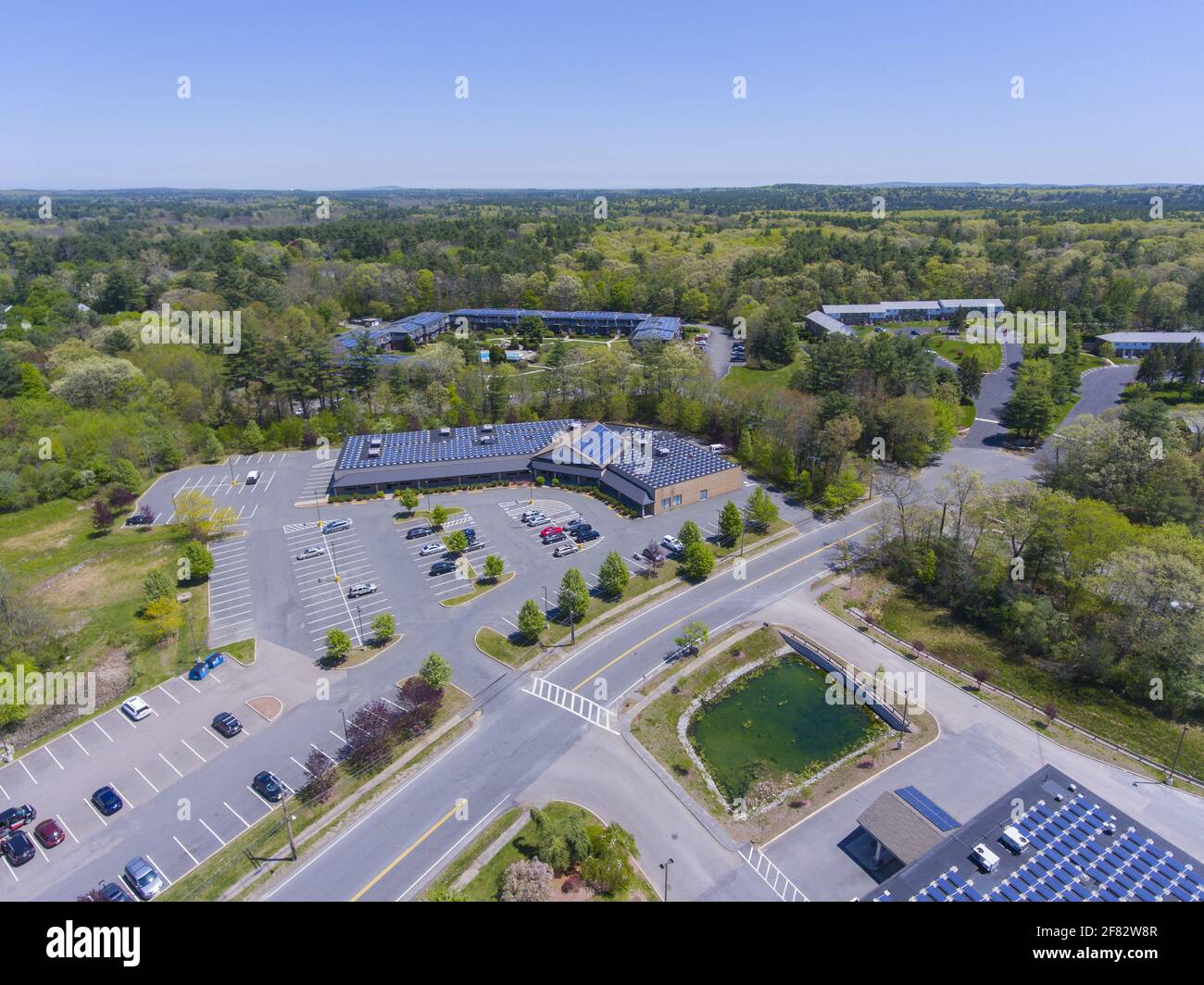 Aerial view of Millis common shopping area and Main Street in spring